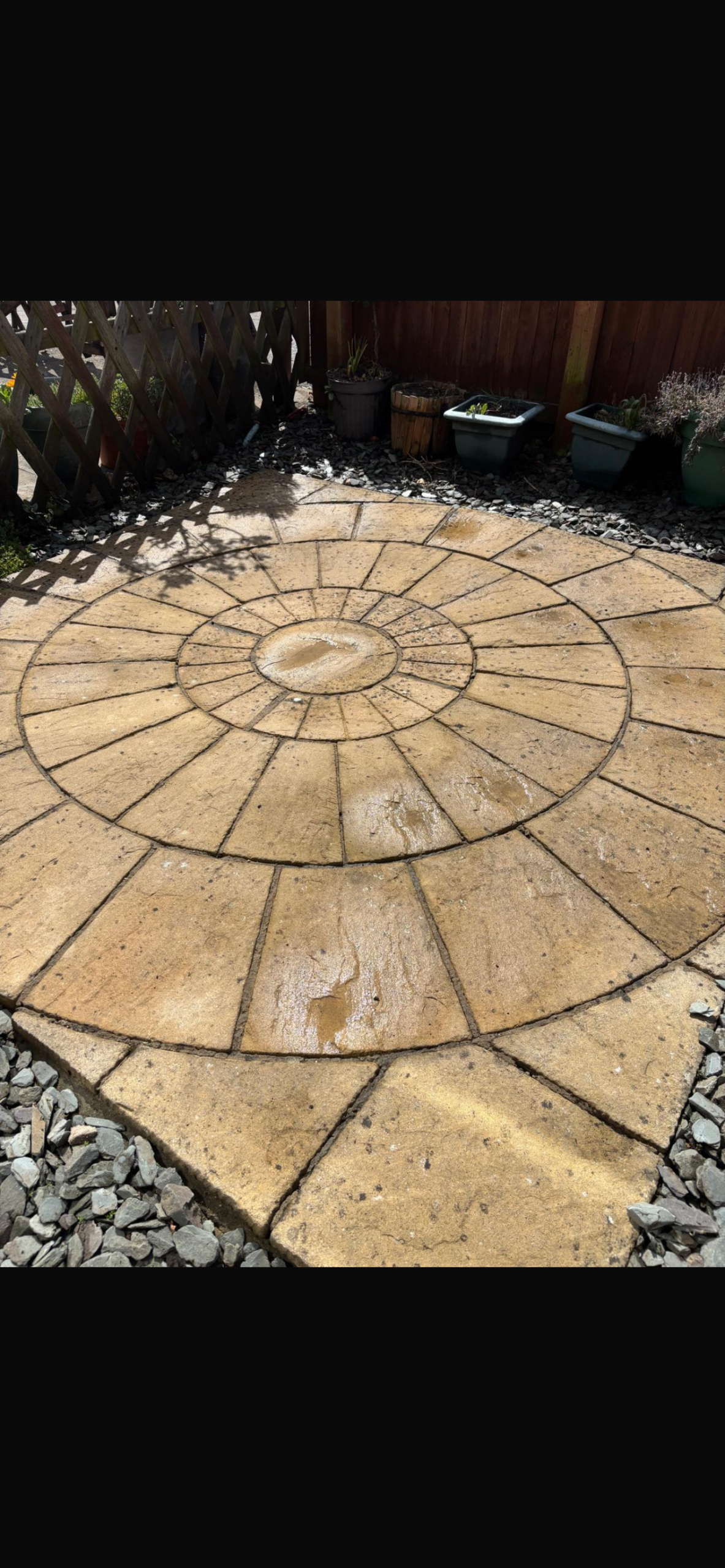 Exterior cleaning before treatment - stained and weathered outdoor surface in need of cleaning
